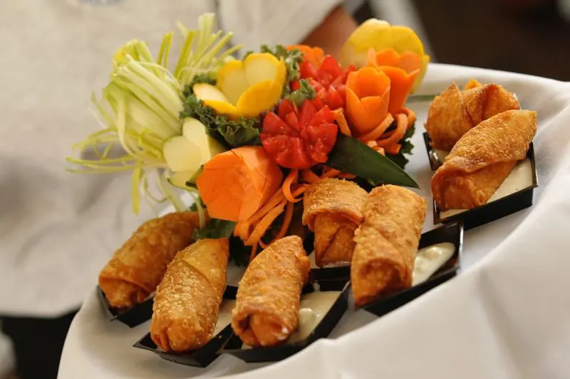 Platter of crispy appetizers with fresh vegetables