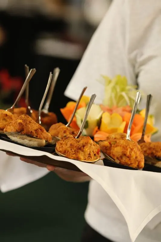 Server presenting passed hors d’oeuvres