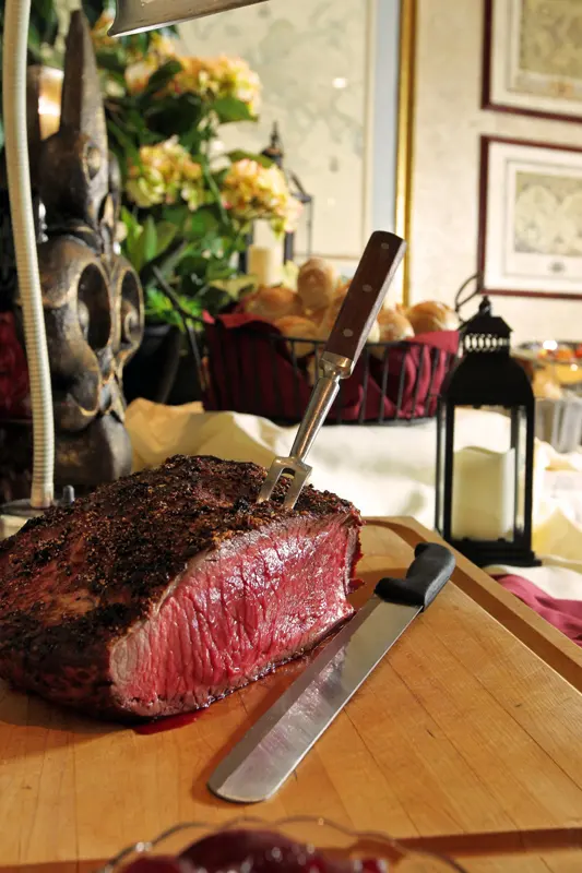 Carving station with beef and flowers