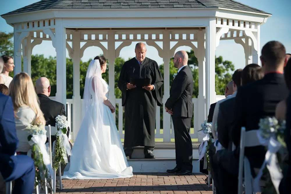 A wedding ceremony in the white gazebo